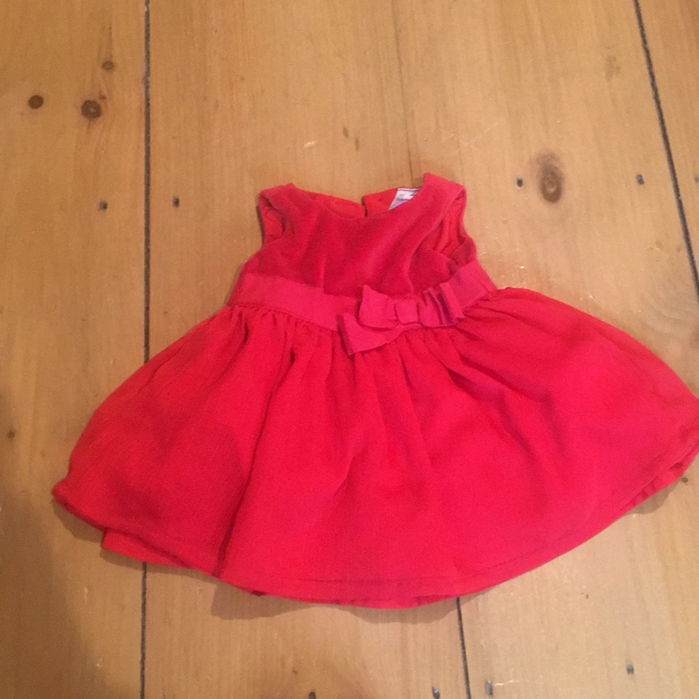 Baby girls red dress with velvet top and bow.